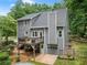Exterior of home features a deck, walk-out basement, and fenced backyard with pool at 1920 Pilgrim Rd, Cumming, GA 30040