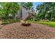 Back of house featuring a fire pit with above ground pool in fenced in backyard at 1920 Pilgrim Rd, Cumming, GA 30040