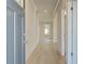 Inviting hallway featuring light wood flooring and ample natural light creating a welcoming atmosphere at 2525 Dixon Pl, Lawrenceville, GA 30045