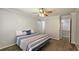 Cozy bedroom with a ceiling fan and neutral carpet flooring for a comfortable living space at 5465 Mountain Top Pl, Cumming, GA 30041