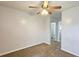 Bedroom showcasing neutral carpet, a ceiling fan, and a closet for ample storage space at 5465 Mountain Top Pl, Cumming, GA 30041