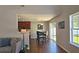 Cozy dining area with dark wood table and chairs, adjacent to the kitchen with sliding glass doors at 5465 Mountain Top Pl, Cumming, GA 30041