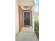 Inviting front entrance featuring a black door, brick accents, and a stylish overhead light fixture at 5465 Mountain Top Pl, Cumming, GA 30041