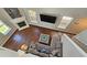 Aerial view of stylish living room with high ceilings, fireplace, and modern furnishings at 5465 Mountain Top Pl, Cumming, GA 30041