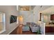 Spacious living room with an open floor plan, high ceilings, hardwood floors, and staircase at 5465 Mountain Top Pl, Cumming, GA 30041