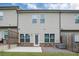 Exterior backyard featuring new siding, green grass, and a back patio at 1360 Sugar Glen Ct, Lawrenceville, GA 30044
