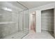 Bathroom features a glass door shower and access to a closet at 1360 Sugar Glen Ct, Lawrenceville, GA 30044