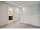 Spacious hallway with modern gray walls leading to a bathroom and other rooms at 1360 Sugar Glen Ct, Lawrenceville, GA 30044