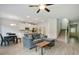 Bright living area with wood-look flooring, modern lighting, and open floor plan at 1360 Sugar Glen Ct, Lawrenceville, GA 30044
