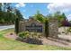 Welcome to Sugarloaf Place stone entrance sign with manicured landscaping at 1360 Sugar Glen Ct, Lawrenceville, GA 30044