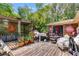 Backyard deck with seating area and decorative signage featuring lush trees creating a serene outdoor experience at 4544 Ridgeview Dr, Powder Springs, GA 30127