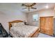 Comfortable bedroom with wooden furniture, patterned bedding, and natural light at 4544 Ridgeview Dr, Powder Springs, GA 30127