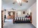 Spacious bedroom with ceiling fan, four-poster bed, large dresser, and two windows for ample natural light at 4544 Ridgeview Dr, Powder Springs, GA 30127
