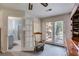 View of primary bedroom featuring double doors leading to the outdoor deck and attached bathroom with glass shower at 4544 Ridgeview Dr, Powder Springs, GA 30127