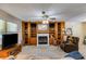 Cozy living room with a fireplace, built-in shelves, and comfortable seating at 4544 Ridgeview Dr, Powder Springs, GA 30127