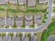 Overhead shot of neatly arranged homes with manicured lawns and mature trees lining the quiet neighborhood streets at 11375 Crestview Ter, Johns Creek, GA 30024