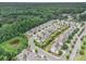 Scenic aerial view of a well-planned community with lush landscaping, tree-lined streets, and serene surroundings at 11375 Crestview Ter, Johns Creek, GA 30024