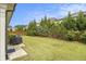 Well-manicured backyard with a stone paver area and lush landscaping at 11375 Crestview Ter, Johns Creek, GA 30024