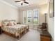 Inviting bedroom with natural light, neutral walls, and plush carpet at 11375 Crestview Ter, Johns Creek, GA 30024