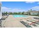 Inviting community pool area with lounge chairs and a well-maintained pool house at 11375 Crestview Ter, Johns Creek, GA 30024