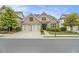 Charming brick home with a two-car garage, lush landscaping, and a welcoming front entrance at 11375 Crestview Ter, Johns Creek, GA 30024