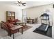 Bright living room with a dining table, seating, and workout equipment at 11375 Crestview Ter, Johns Creek, GA 30024