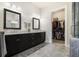 Main bathroom featuring double vanity and walk-in closet at 11375 Crestview Ter, Johns Creek, GA 30024