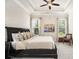 Spacious main bedroom with trey ceiling and sunlit windows offering scenic views at 11375 Crestview Ter, Johns Creek, GA 30024