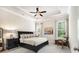 Spacious main bedroom with tray ceilings, plush carpet, and ample natural light at 11375 Crestview Ter, Johns Creek, GA 30024