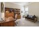 Comfortable office space with natural light and custom wood built-ins at 11375 Crestview Ter, Johns Creek, GA 30024