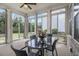 Bright sunroom with large windows, perfect for relaxation and entertaining at 11375 Crestview Ter, Johns Creek, GA 30024