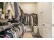 Large walk-in closet with ample shelving and storage space at 11375 Crestview Ter, Johns Creek, GA 30024