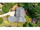 Aerial view of a beautiful home surrounded by mature trees and lush landscaping at 2301 Kirk Farm Nw Pl, Kennesaw, GA 30152