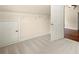 Spacious attic room with carpeted floor and wire shelving; ideal for storage or future expansion at 2301 Kirk Farm Nw Pl, Kennesaw, GA 30152