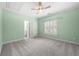 Light bedroom with large windows and view into bathroom at 2301 Kirk Farm Nw Pl, Kennesaw, GA 30152