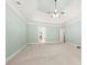 Spacious bedroom featuring tray ceilings, neutral carpet, and access to ensuite bath at 2301 Kirk Farm Nw Pl, Kennesaw, GA 30152