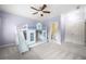 bedroom with a bunk bed featuring a built in slide and an attached bathroom at 2301 Kirk Farm Nw Pl, Kennesaw, GA 30152