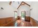 Bonus room featuring hardwood floors, wood paneling, exposed wood beams and natural light at 2301 Kirk Farm Nw Pl, Kennesaw, GA 30152