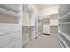 Walk-in closet with built-in shelving and drawers, offering ample storage space at 2301 Kirk Farm Nw Pl, Kennesaw, GA 30152