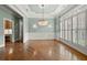 Elegant dining room with hardwood floors, chandelier, and decorative wall paneling at 2301 Kirk Farm Nw Pl, Kennesaw, GA 30152