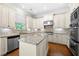 Spacious kitchen with granite countertops, stainless steel appliances, and a center island at 2301 Kirk Farm Nw Pl, Kennesaw, GA 30152