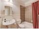 Bathroom featuring a pedestal sink, tiled shower, and bathtub at 255 Beech Tree Holw, Sugar Hill, GA 30518
