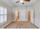 Bedroom featuring carpet, neutral paint, and an ensuite bath with a vanity and a shower-tub combo at 255 Beech Tree Holw, Sugar Hill, GA 30518