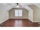 Inviting bedroom with hardwood floors, a large window, and neutral-colored walls at 255 Beech Tree Holw, Sugar Hill, GA 30518