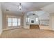 Inviting bonus room with steps up to living room featuring a fireplace, and stylish lighting at 255 Beech Tree Holw, Sugar Hill, GA 30518