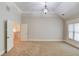 Expansive bonus room with an ornamental chandelier and an open doorway to an adjacent room at 255 Beech Tree Holw, Sugar Hill, GA 30518