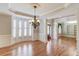 Spacious dining room with hardwood floors, large windows, and elegant trim work at 255 Beech Tree Holw, Sugar Hill, GA 30518