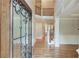 Grand foyer featuring hardwood floors, staircase with iron railings, and soaring ceilings at 255 Beech Tree Holw, Sugar Hill, GA 30518