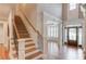 Elegant foyer with high ceilings, wood floors, and staircase at 255 Beech Tree Holw, Sugar Hill, GA 30518