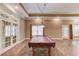 Large game room with a pool table and tile flooring at 255 Beech Tree Holw, Sugar Hill, GA 30518